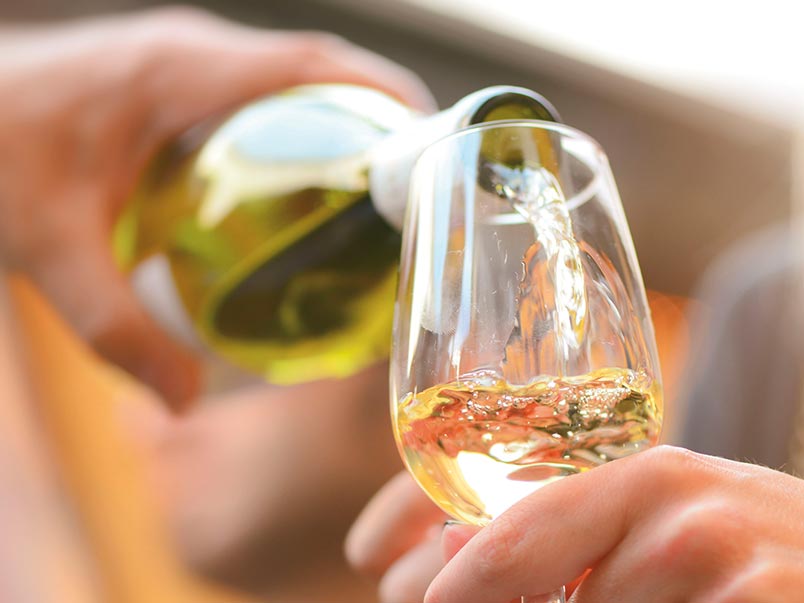White wine being poured into a glass